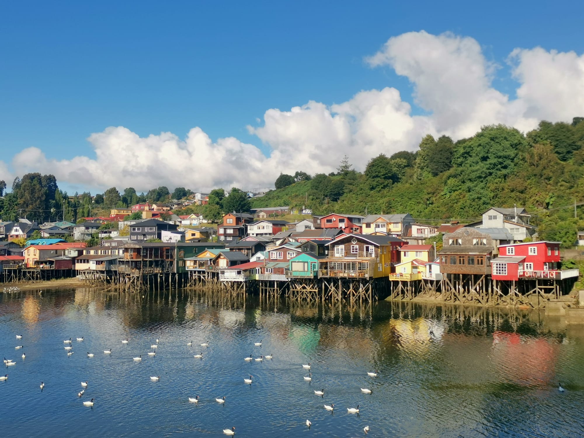 Colourful Palafatio stilt-houses in the tidal waters of Castro, Chiloe island, Chile.