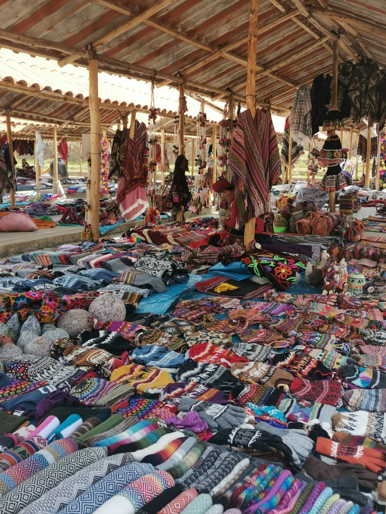 Covered stalls in the chinchero market, where locals sell their handmade goods