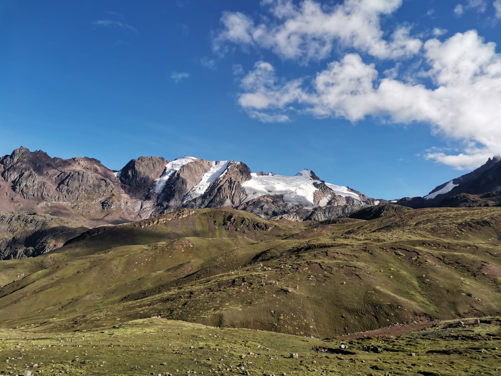 Glaciers, mountains, and valleys surrounding Rainbow Mountain