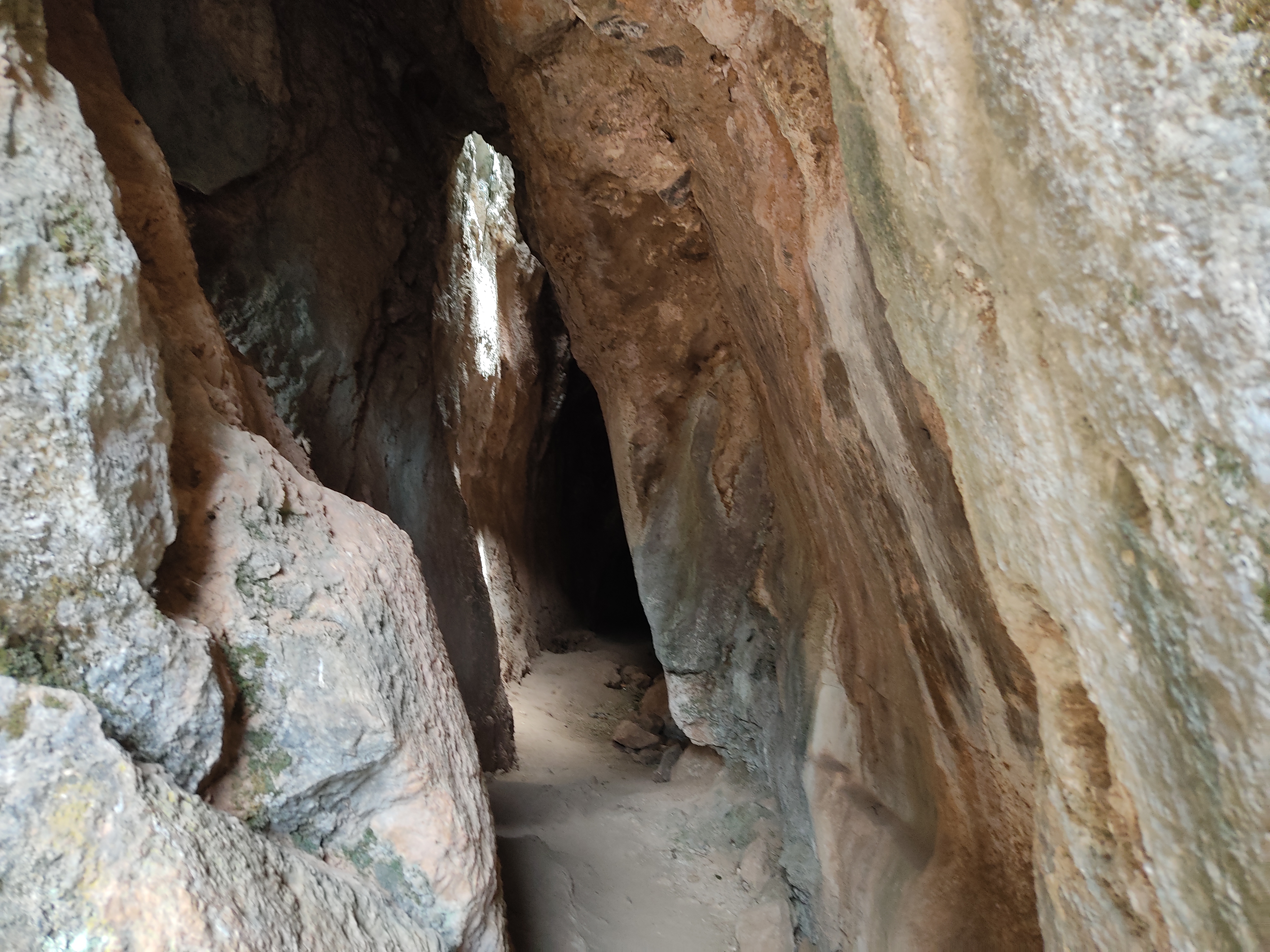 Dark passageway between large rocks