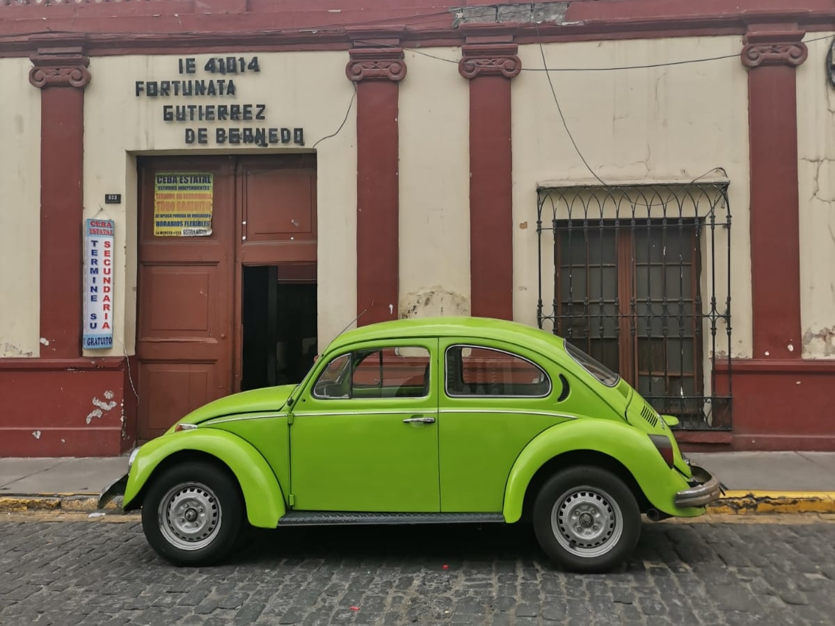 Green WV beetle car in Peru