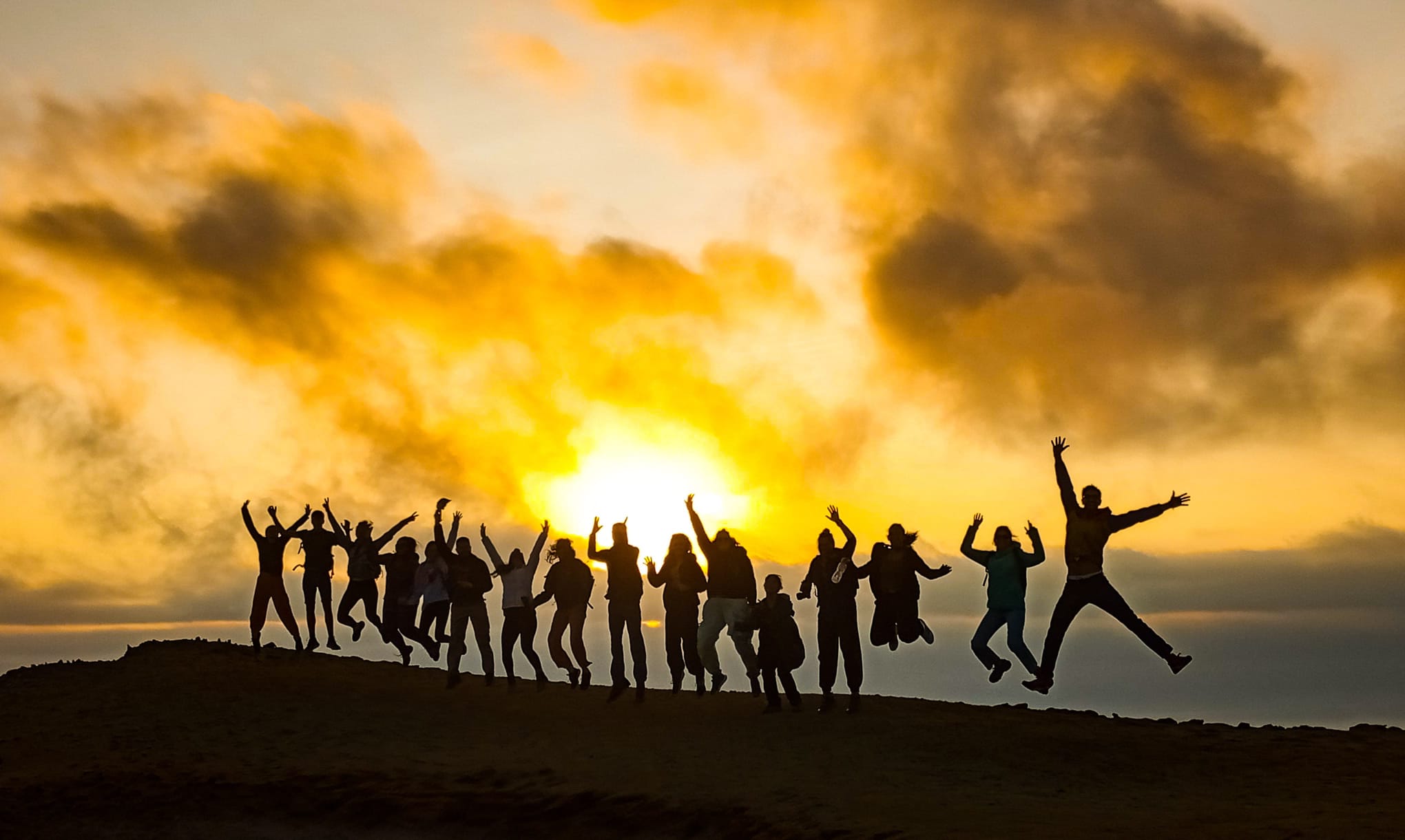 Silhouettes of tour of Paracas nature reserve at sunset