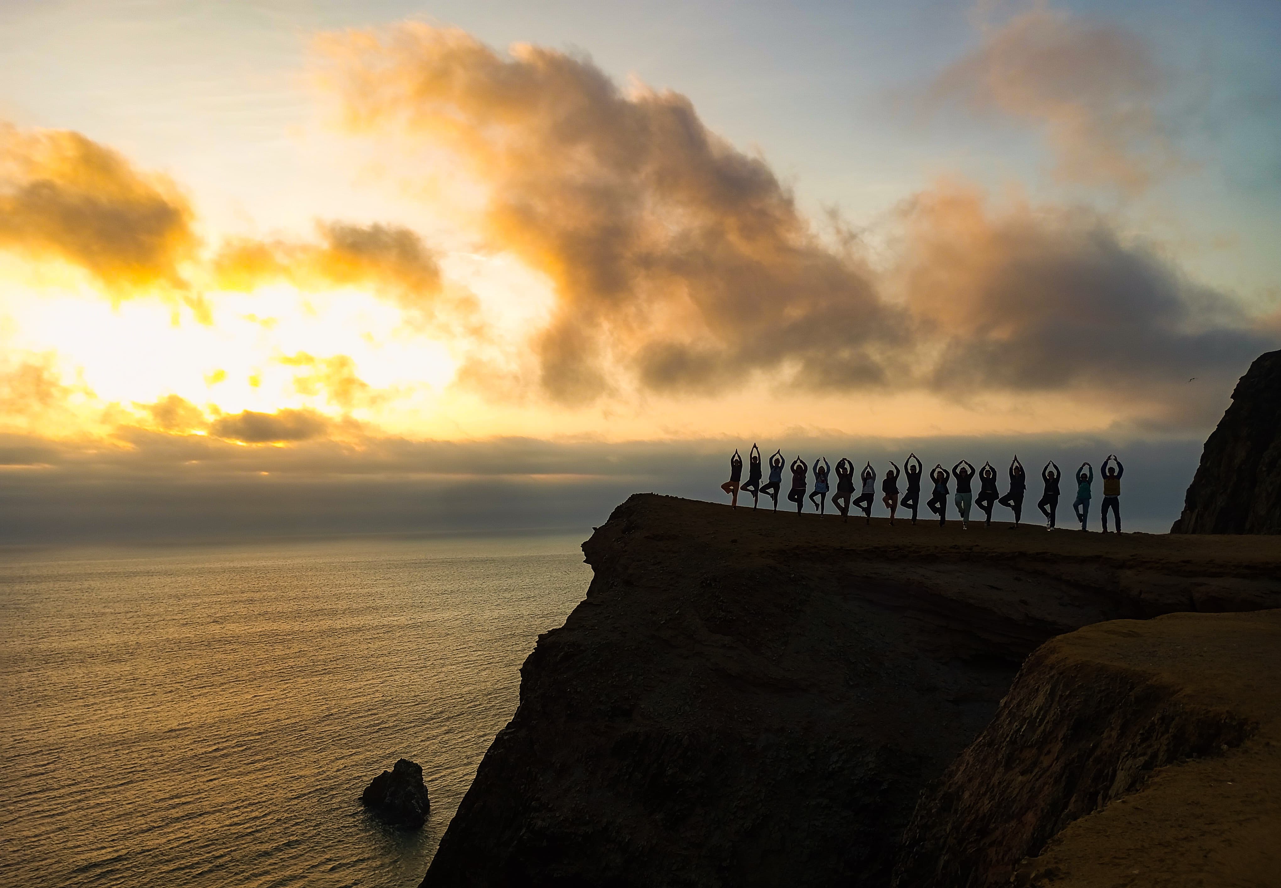 Silhouettes of tour of Paracas nature reserve at sunset